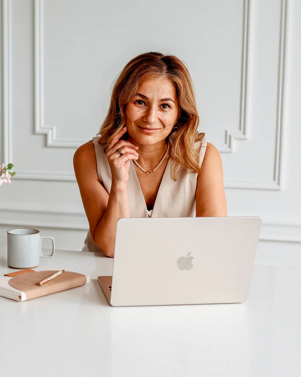 Michaela Morari at her desk, ready for an online coaching session